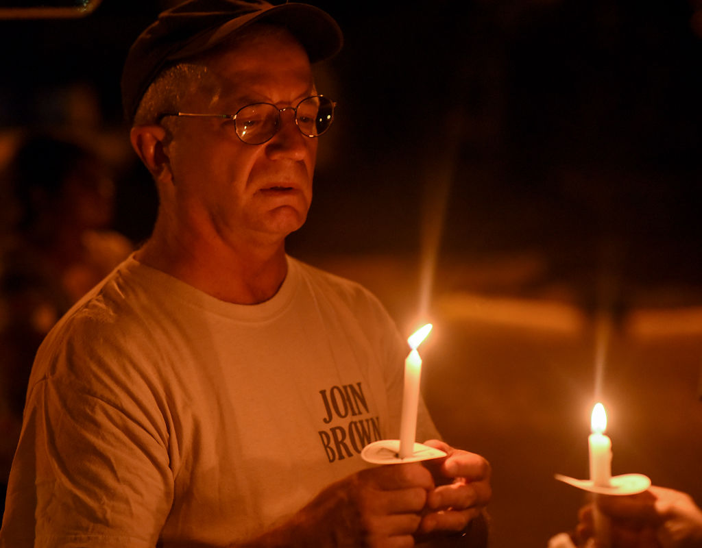 Columbia resident Dirk Burhams draws his candle close